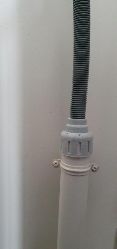 Hose support for washing machine