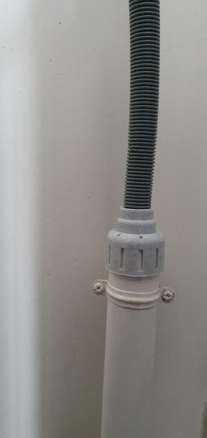 Hose support for washing machine