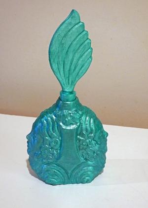 Bottle with faces and quill stopper