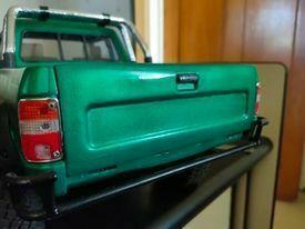 pickup truck tailgate stepped filler panel with handle