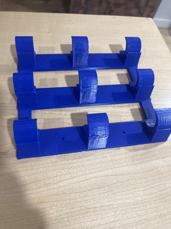 One piece wrapping paper holder w/ screw holes