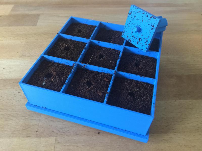 Seed germination tray with removable base and stamp
