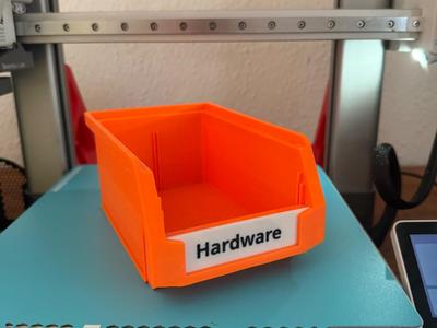 Stackable storage bins with customisable labels
