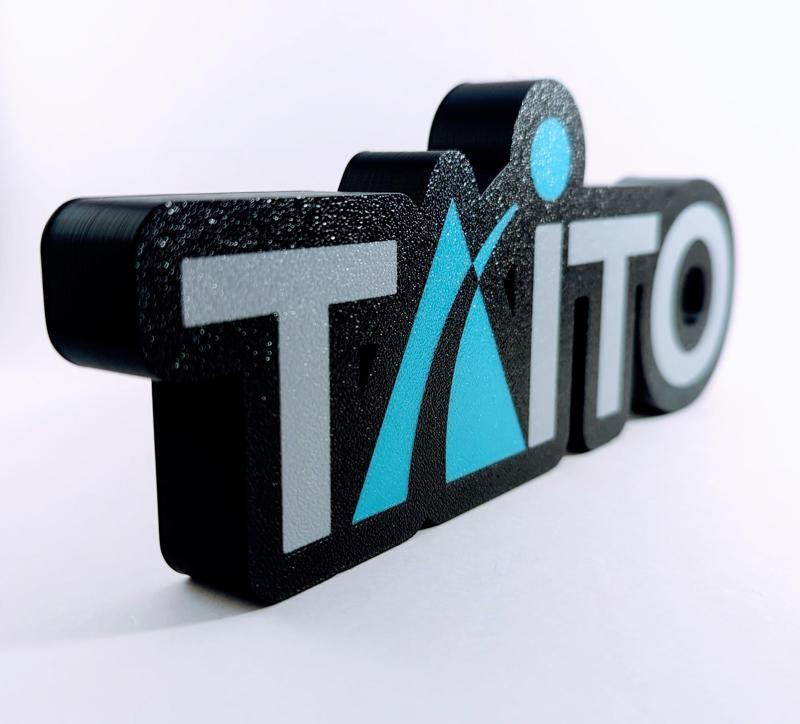 Taito display piece and magnet sign.