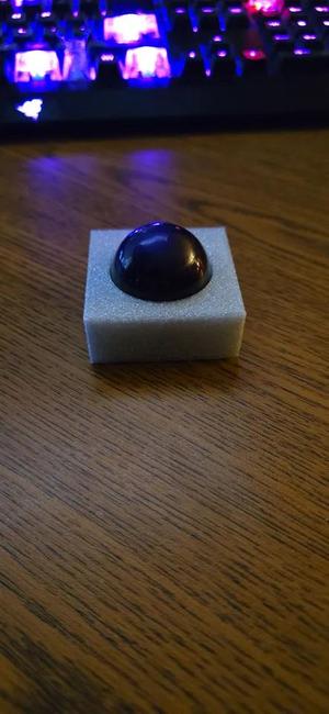 a holder for a 34mm trackball   