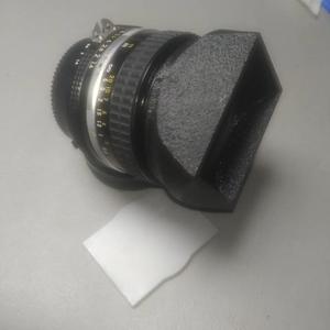 Slip on Compact Hood + Cover for 50mm prime lens with 52mm dia. filter ring.   