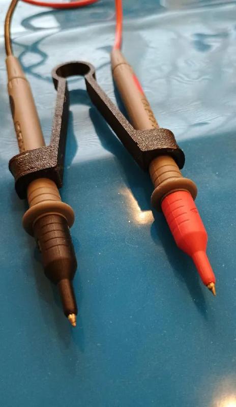 Probe tweezers with heat moldable pads   