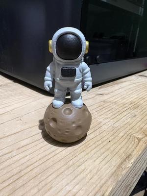 Astronaut spaceman on rock   