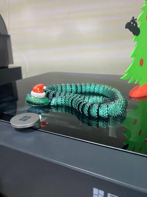 Tree Snake Symbol of the New Year 2025 in Christmas hat