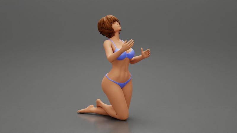 Sexy girl in bikini with short hair sitting on her knees