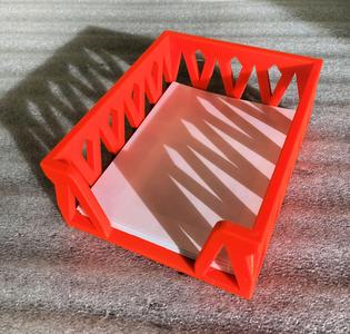 A decorative  tray to hold note paper