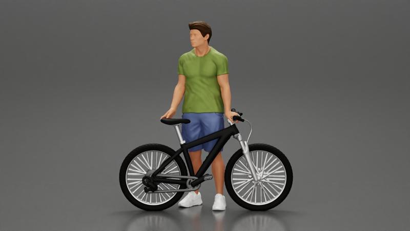 Young Man Standing In The Forest Posing Proudly With His Bike