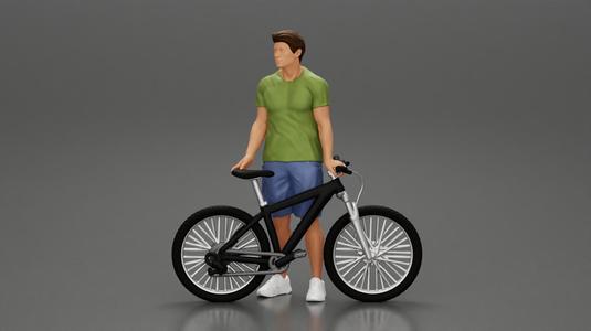 Young Man Standing In The Forest Posing Proudly With His Bike