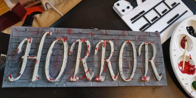 Horror word on wall background