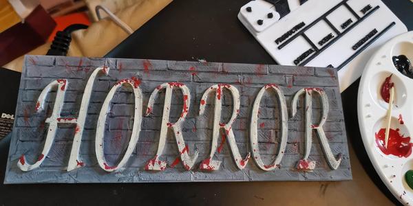 Horror word on wall background