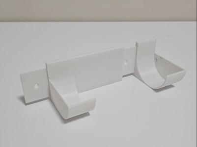 Trash bag holder. Adjustable for different sizes.