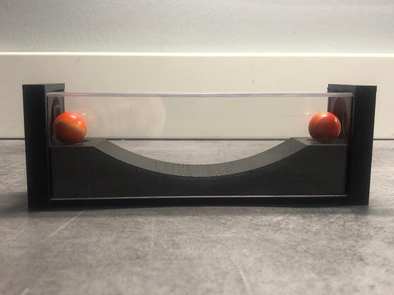 Two marbles puzzle (acrylic plate version)