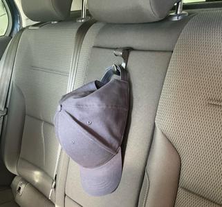 Holder for e.g. a cap to fix on lug of foldable armrest
