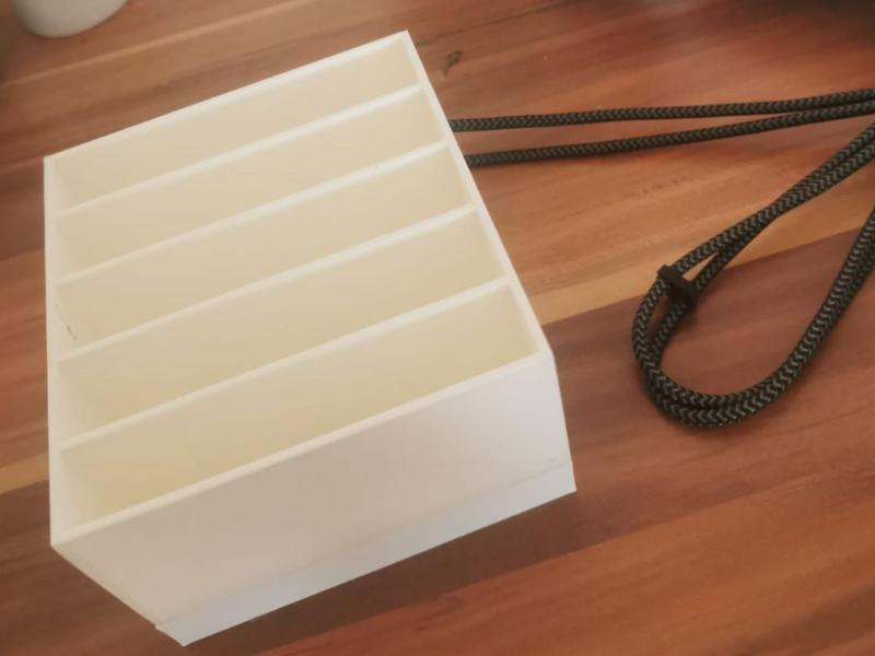 Handy holder with integrated charging station.