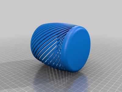 A round bulging pencil cup like a vase with rectangular slits