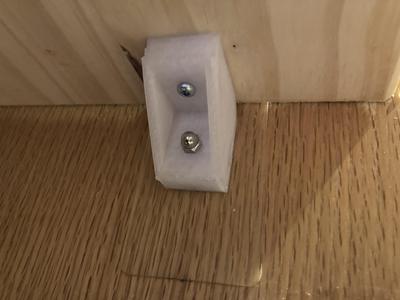 Shelf holder for adhesive studs.