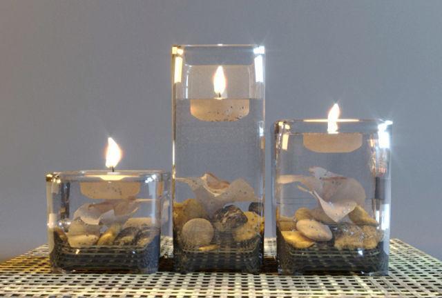 vaseandcandle three glass candle holders on table