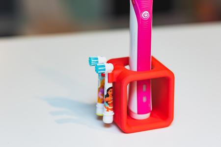 Oral B electric toothbrush stand with brush holder
