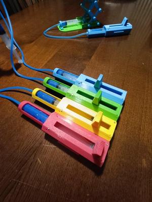 Control panel for hydraulic tools with syringes