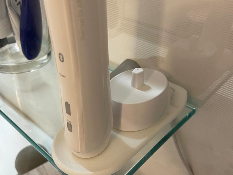 Electric Oral-B toothbrush coaster