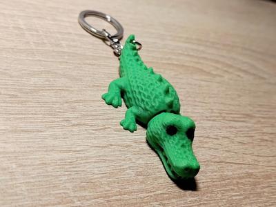 Knitted articulated crocodile keychain