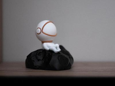 Adorable Astronaut Chilling on His Asteroid   