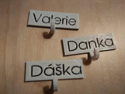 Create a name tag with a small hook for keys