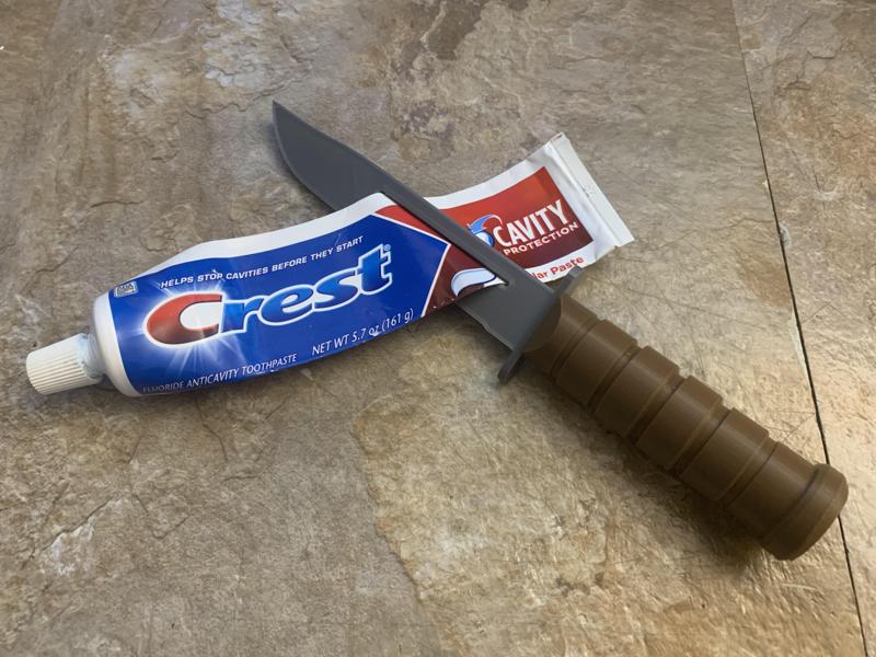 KA-BAR toy knife and toothpaste squeezer squeegee