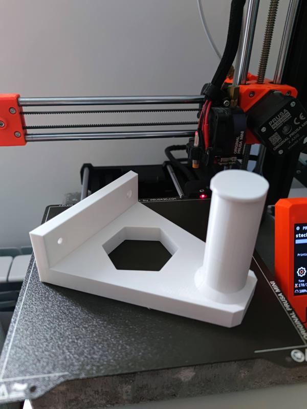 Spool holder wall mount with hexagon negative