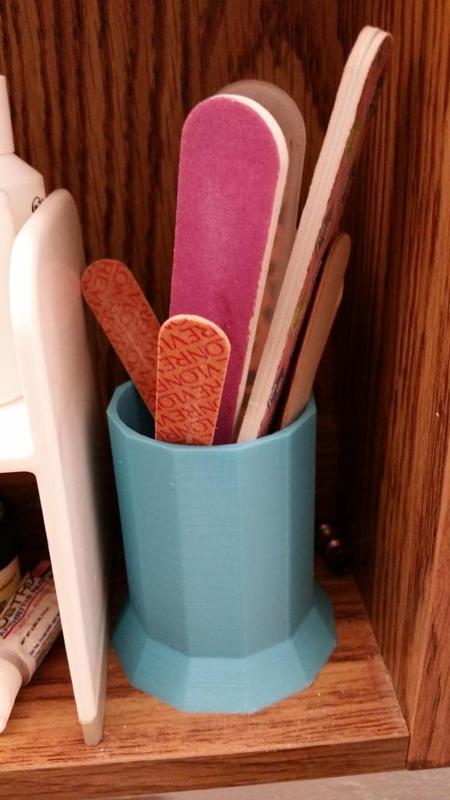 Nail file holder / makeup brush