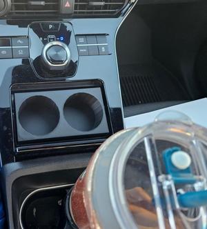 Bz4x cup holder for phone charging spot