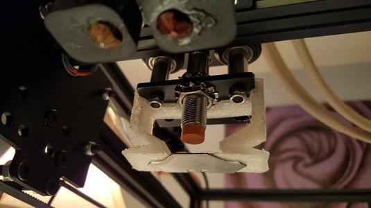 Self-positioning induction trigger for WeldingRodBot