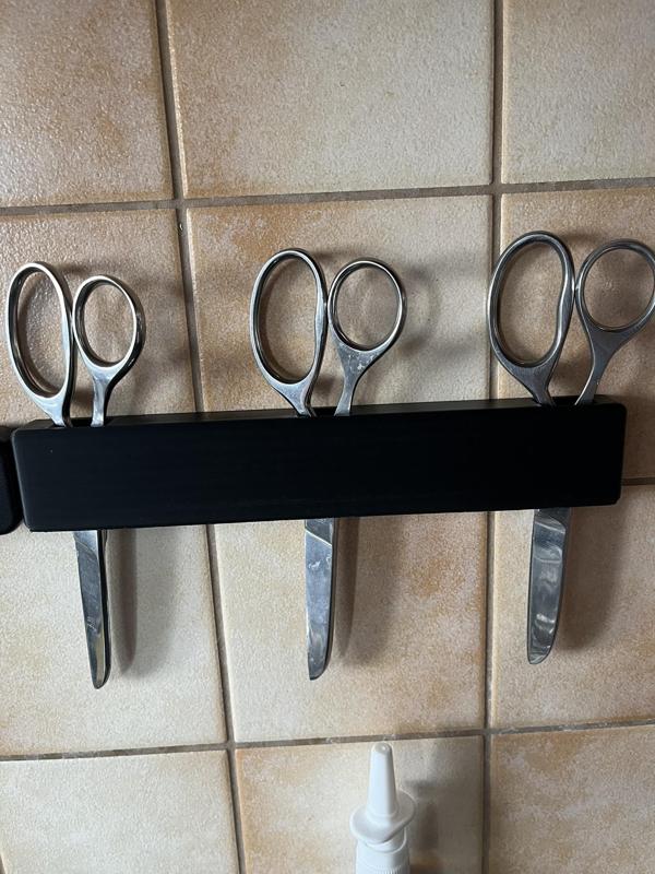 holder for three scissors on the wall
