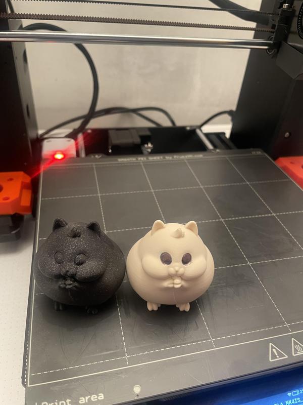 Fat Hamster, with TOMBIK written on his butt.