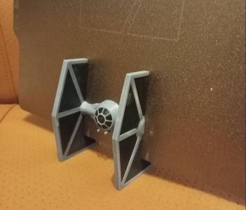 Tie fighter plate holder