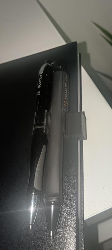 Notebook pen clip holder