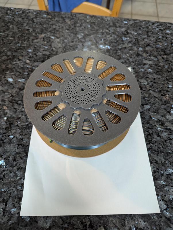 Adapter for the core of a cardboard spool