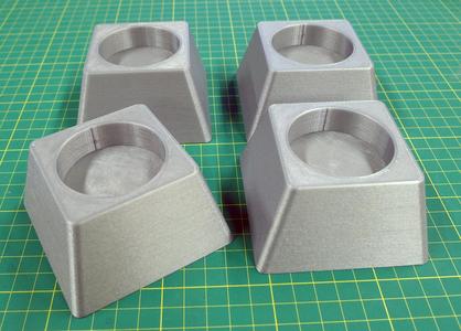 Risers for pinball cabinets