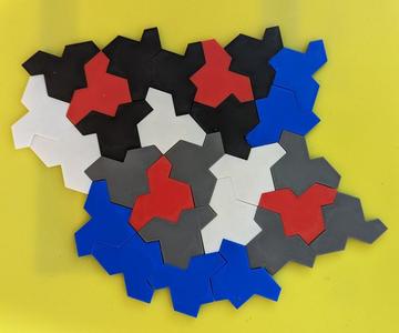 Reversible aperiodic hat tiles