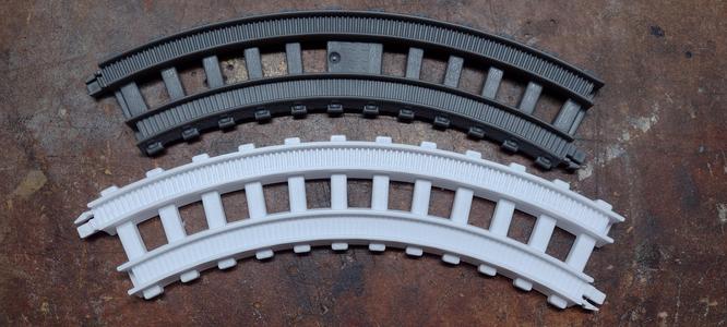 Curved train track section