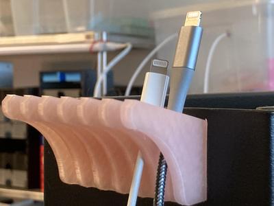USB cable hanger with magnet hole