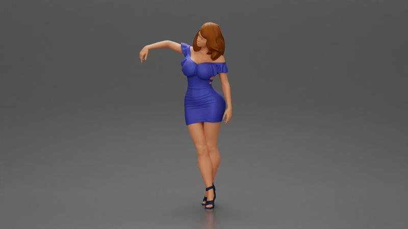 Elegant pose in vibrant blue dress with matching high heels