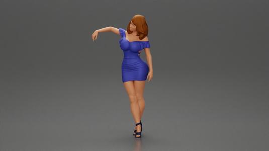 Elegant pose in vibrant blue dress with matching high heels