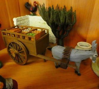 A cart with crates of vegetables and fruit