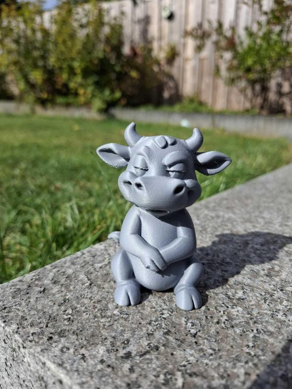 Mischievous Cow Figurine
